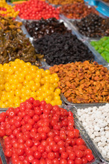 Colorful dried salted or sugared Asian tropical fruits