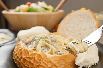 Pasta with Cream Sauce in Bread 