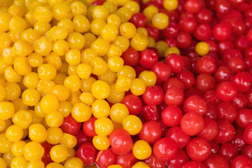 Colorful dried salted or sugared Asian tropical fruits
