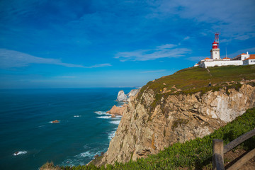Fototapeta na wymiar The lighthouse of the Westernmost of Europe, Roca Portugal / Cape Roca the Westernmost of Europe, Portugal