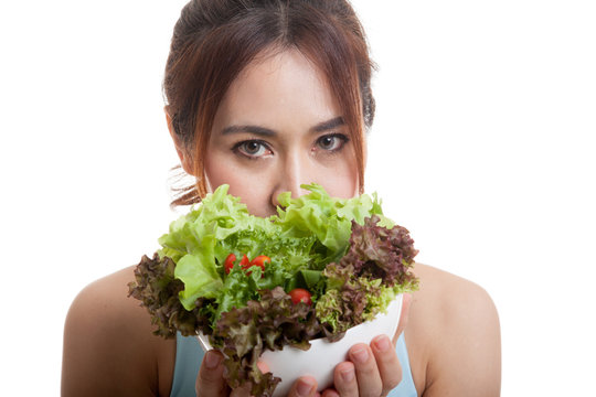 Beautiful Asian healthy girl with salad.
