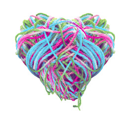 multicolored tangled yarn heart shape on white background.