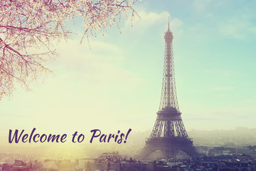 Welcome to Paris! Aerial view of Paris cityscape with Eiffel tower at sunset. Vintage colored picture Love and travel concept