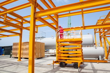 Yellow steel construction in open at factory.