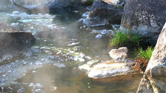 Flowing of hot water at hot spring in Jae Sawn National Park, Lampang, Thailand