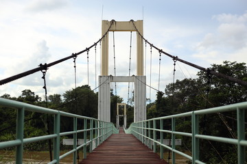 suspension bridge across the river at Ubon in Thailand