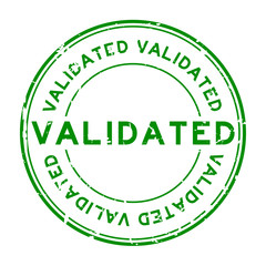 Grunge green validate round rubber stamp on white background