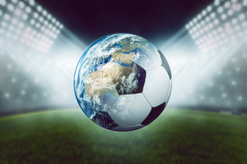 Fototapeta na wymiar Fussball mit Welt vor Stadion