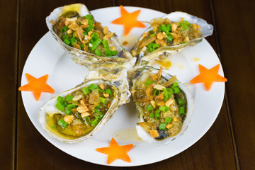 Barbecue geoduck with onion and grease. Asian food