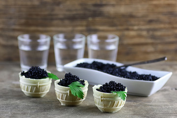 black caviar on a wooden background