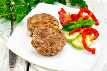 Cutlets stuffed with basil on light board