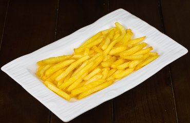 Close up Crispy Potato Fries on white dish