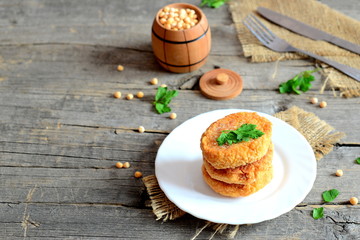 Delicious vegetarian patties made from peas. Simple vegetarian patties recipe. Wooden background with blank space for text. Getting protein without meat. Meatless meals