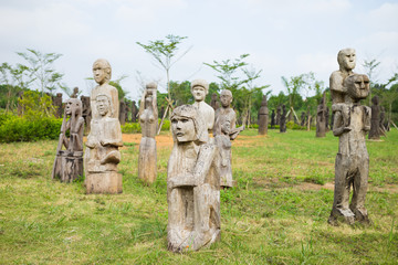 The wooden statue (woman, man, kid) on the tombs of the Central Highlands, Vietnam is (object...