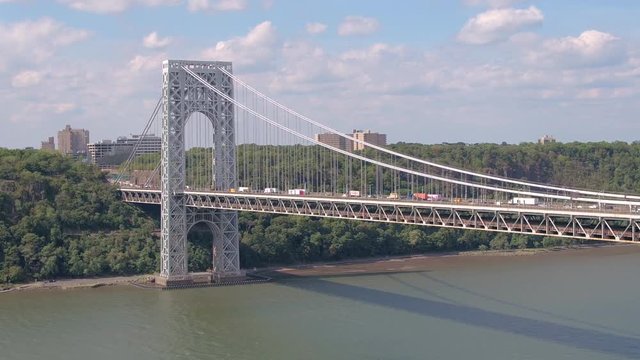 AERIAL: Congested Traffic On Highway Suspension Bridge Leading To New York City