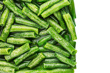 Border of wet fresh green french bean in water  closeup on white background. Isolated. Healthy vitamin food.
