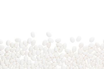 Border of white  kidney beans closeup with copy space on white background. Isolated. Healthy protein food.