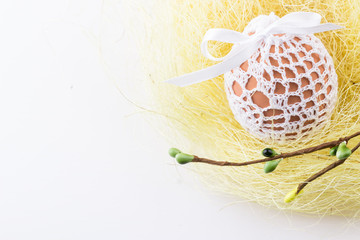 Easter egg in yellow nest