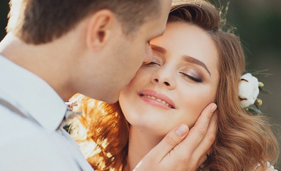 Fototapeta premium The bride and groom in nature. Rustic Wedding