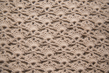Brown sweater knitted in manual photographed in close-up.