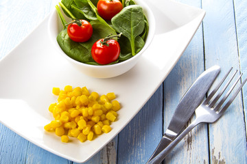 spinach tomato salad food fresh healthy cook rustic wooden background
