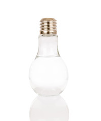 Bottle-shaped lamp and water on white