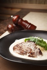 steak cream pasta on table