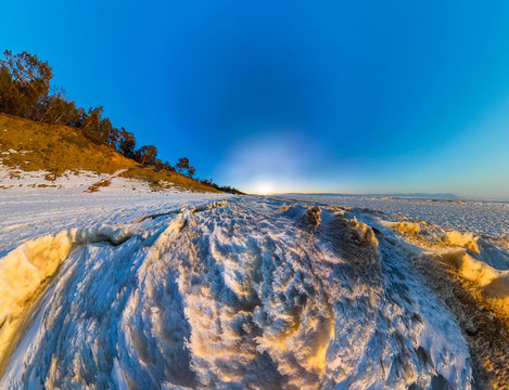 Aerial panorama of snow sunrise wave on the shore of Olkhon. Bai