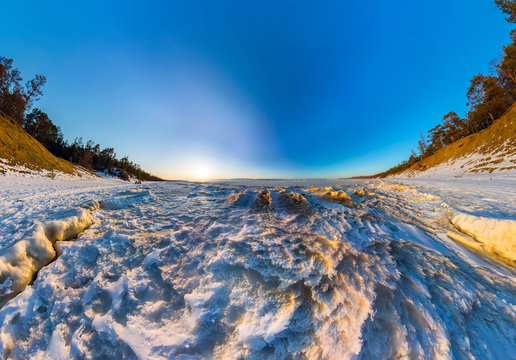 Aerial panorama of snow sunrise wave on the shore of Olkhon. Bai