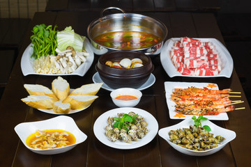 Set of Vietnamese seafood with Barbecue tiger shrimps, grilled sweet snail, bread slide, Spicy...