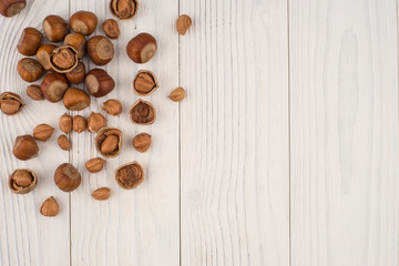 Hazelnuts on a old wooden table.