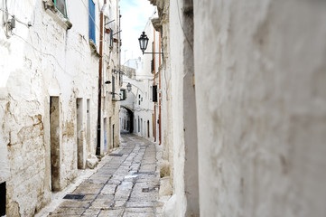 narrow alleyway in Ostuni, Apulia, Italy