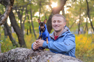 The guy with the dog in the park