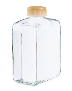 Closeup of a clear glass square bottle and no lable