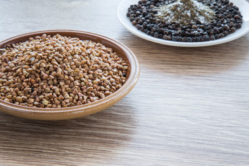 Buckwheat on the wooden board. Healthy eating and lifestyle.