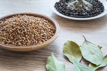 Buckwheat on the wooden board. Healthy eating and lifestyle.