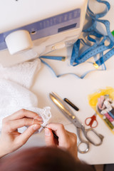 Young girl engaged in needlework