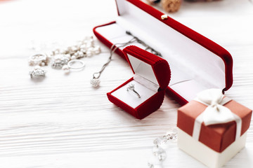 valentine day concept. stylish diamond ring in red present box a