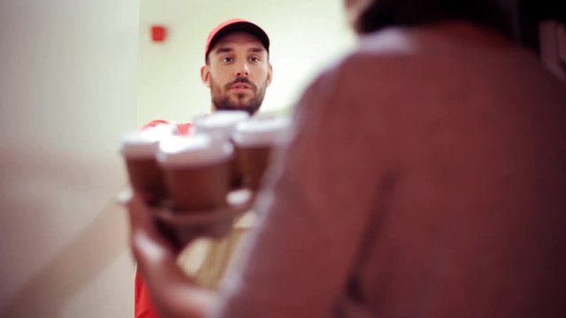 man delivering coffee and food to customer home