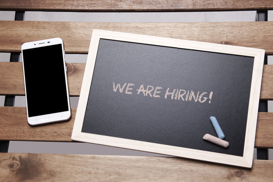 Chalkboard Concept - We Are Hiring with Mobile Phone