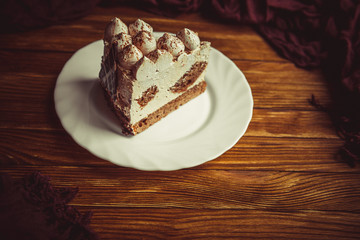 Appetizing cake on a wooden table.