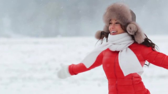 happy woman having fun outdoors in winter