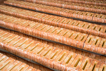 Molds for producing Asian ceramic roof tiles in production workshop