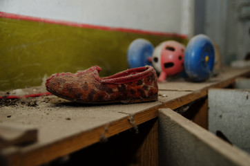 Soviet shoes children slippers in dust at Chernobyl nuclear disa