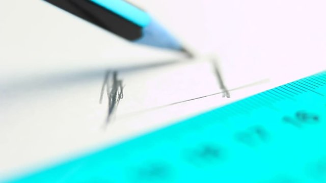 Using ruler on white paper.