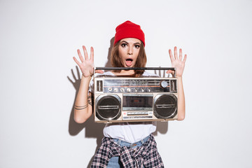 Young lady holding tape recorder.