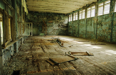 Fototapeta na wymiar Lost school sport gym at Chernobyl city zone of radioactivity gh