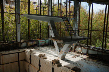 Lost school sport gym with swimming pool at Chernobyl city zone