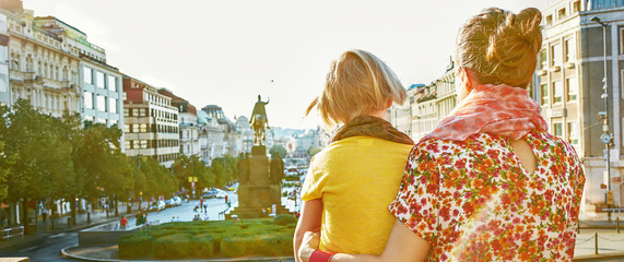 mother and daughter tourists exploring attractions in Prague