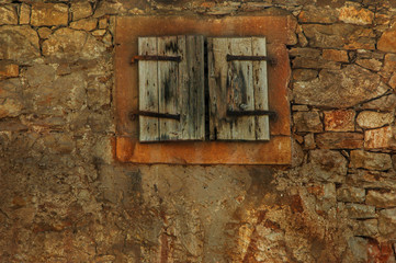 Worn wooden window in a village in Croatia